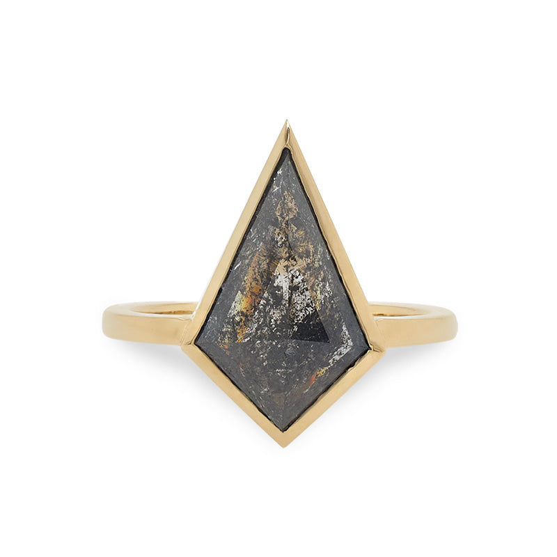 Front view of 2.27 ct solitaire ring, cast in 14 kt yellow gold, dark salt and pepper diamond in a kite-shaped cut.