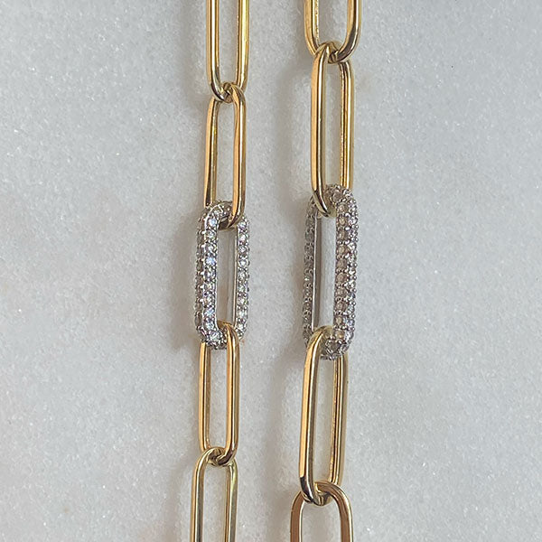 
                  
                    Load image into Gallery viewer, One small and one medium paperclip style bracelet shown on a white background in 14 kt yellow gold with the center link made of 14 kt white gold and pave diamonds.
                  
                