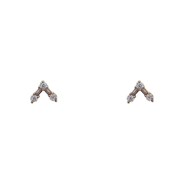 Front view of studs with round and baguette diamonds arranged in V. Set in 14 kt yellow gold. Displayed on white background.