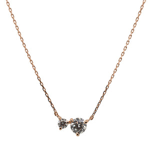 
                  
                    Load image into Gallery viewer, Front view of a round cut double diamond necklace made of solid 14 kt rose gold.
                  
                