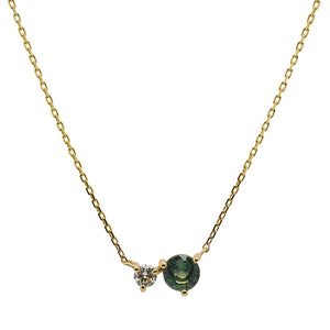 
                  
                    Load image into Gallery viewer, Front view of a round cut green sapphire and diamond necklace made of solid 14 kt yellow gold.
                  
                