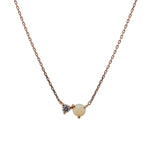 Front view of an east west set opal and 0.06 ct. white diamond pendant necklace cast in 14k rose gold.