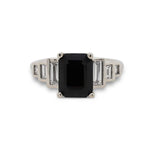 Front view of emerald cut black sapphire ring with 6 baguette cut diamonds set in 14 kt white gold.