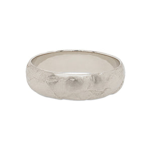 
                  
                    Load image into Gallery viewer, Front view of a 6.5 mm wide rounded band with an organic texture cast in 14 kt white gold.
                  
                