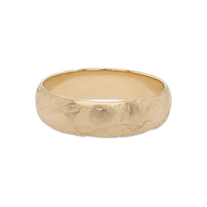
                  
                    Load image into Gallery viewer, Front view of a 6.5 mm wide rounded band with an organic texture cast in 14 kt yellow gold.
                  
                