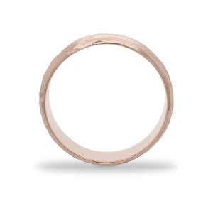 
                  
                    Load image into Gallery viewer, Side view of a 6.5 mm wide rounded band with an organic texture cast in 14 kt rose gold.
                  
                