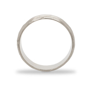 
                  
                    Load image into Gallery viewer, Side view of a 6.5 mm wide rounded band with an organic texture cast in 14 kt white gold.
                  
                